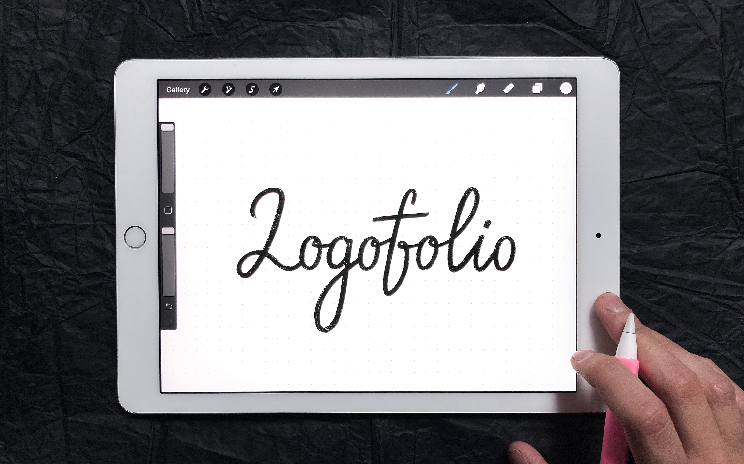 An ipad with a hand-lettered sign "lofogolio"