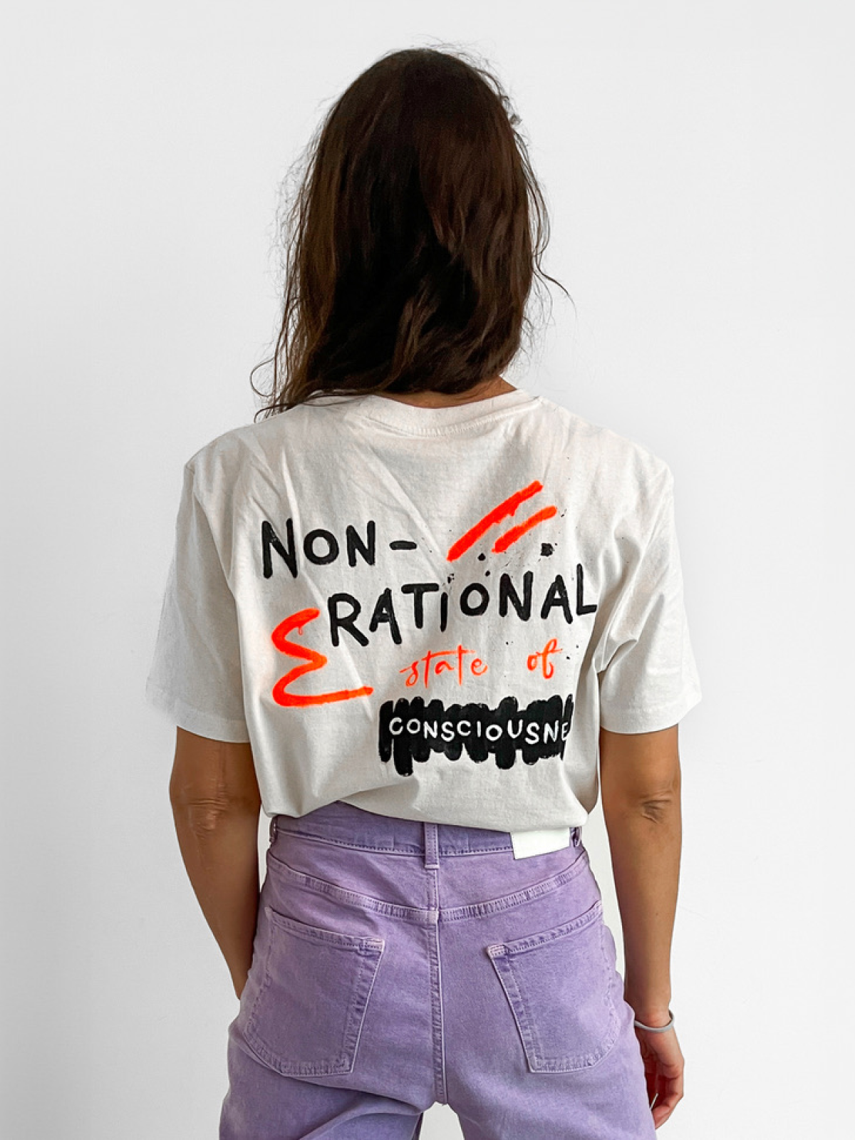 Custom lettering hand-painted shirt with a sign "non-rational state of consciousness"